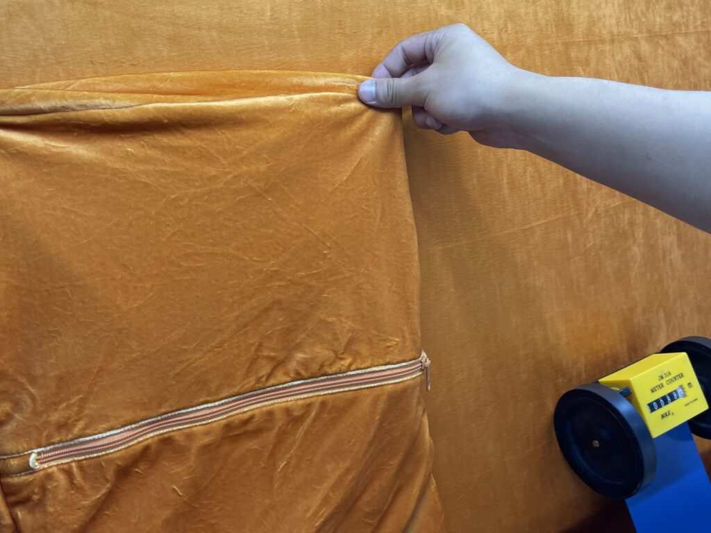 China sourcing agent performing quality control inspection QC on fashion garments to ensure sizing accuracy