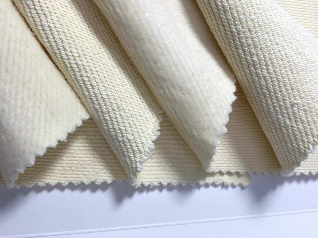 Close up texture of heavy French Terry cotton sourced from a premium heavyweight hoodie manufacturer