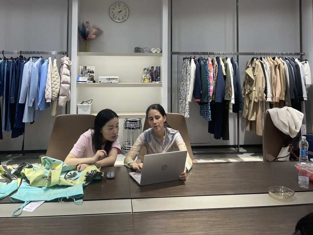 Expert China sourcing agent explaining how to offset China tariffs 2026 for global buyers and disscuss the development meeting